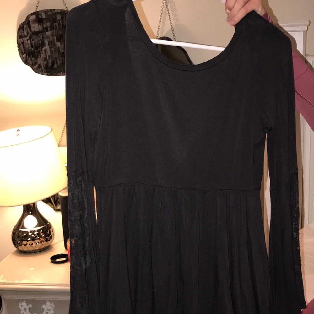 Super cute bell sleeves with lace and open back